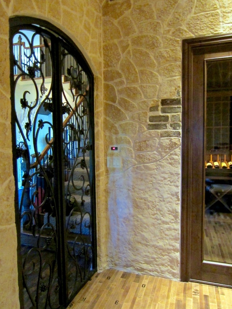 Texas wine cellar door made from iron gate and glass