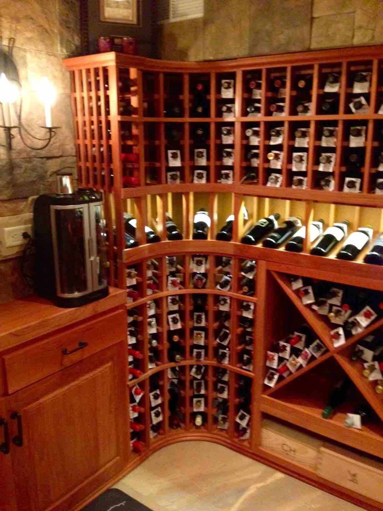 Curved Wine Rack Corner with Lighted Display Row in Illinois Home Wine Cellar